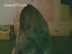 An amateur milf gets screwed in her cookie by a large, athletic dog.